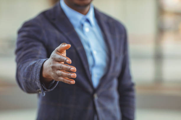 istock African American businessman extending hand to shake. 1312913178