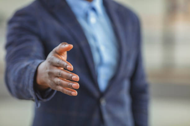istock Confident businessman stretching his hand for greeting. 1312913945