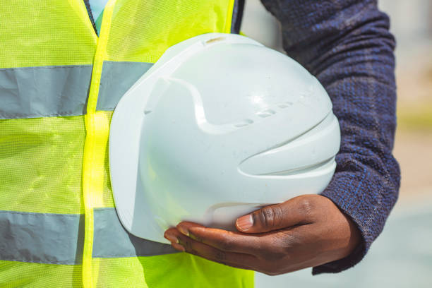 istock Man holding white helmet close up. 1312914899
