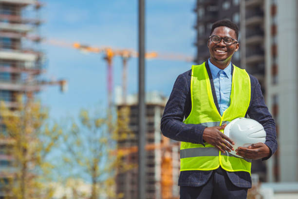 istock Close up Businessman holding white hard hat builder construction estate. 1312914904
