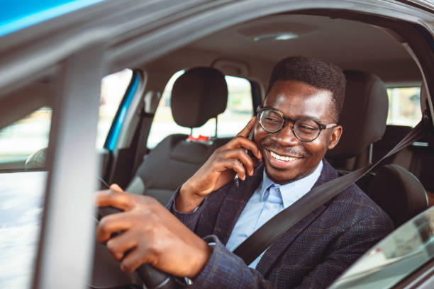 istock Man talking on the smartphone and driving a car. 1312915152