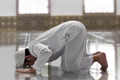 Religious asian muslim man praying