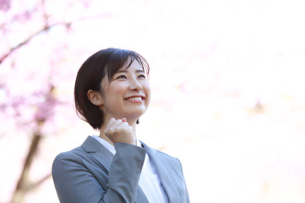 Smile female employee Smile female employee punching the air stock pictures, royalty-free photos & images