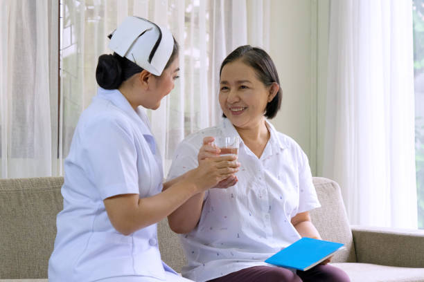 istock Senior woman with nurse. 1312919972