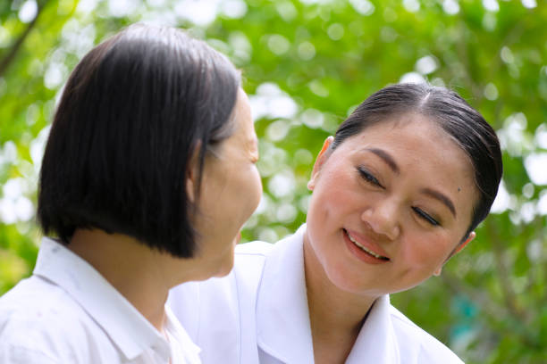 istock Senior woman with nurse. 1312919978