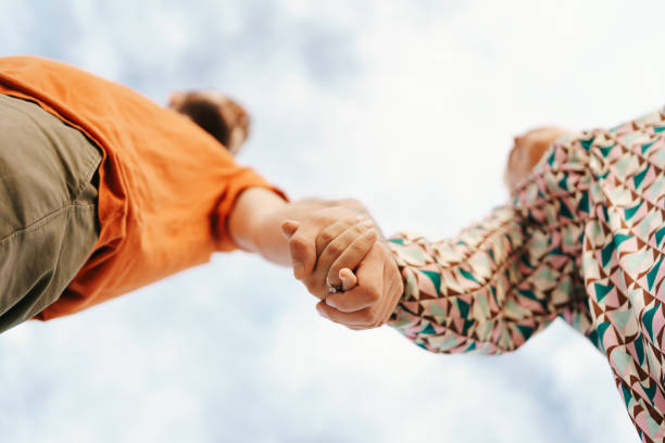 istock Happy couple on sky background 1312921327