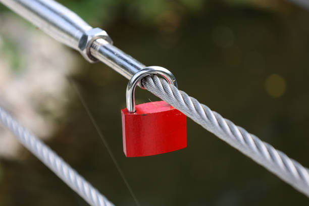 istock Red lock of love on the bridge 1312923592