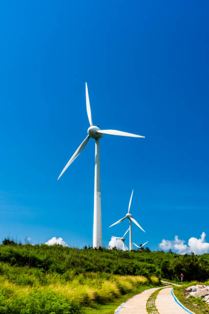 istock Close-up of windmills group with blue sky 1312923669