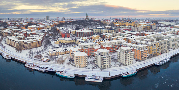 Panoramic winter view of the Södermalm district in Stockholm by the Hammarby lake.