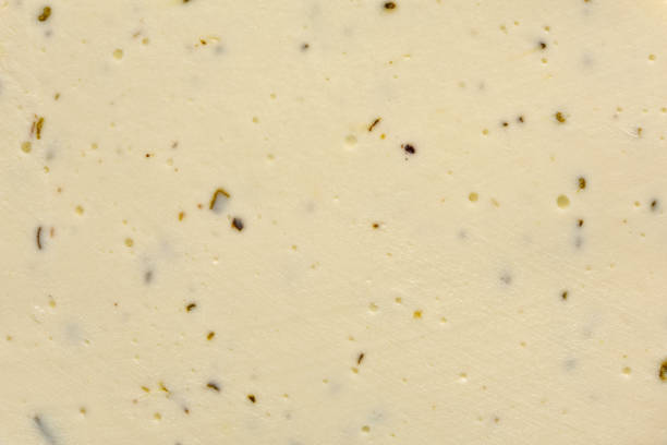 istock White cheese with provence herbs background or texture. 1312928177