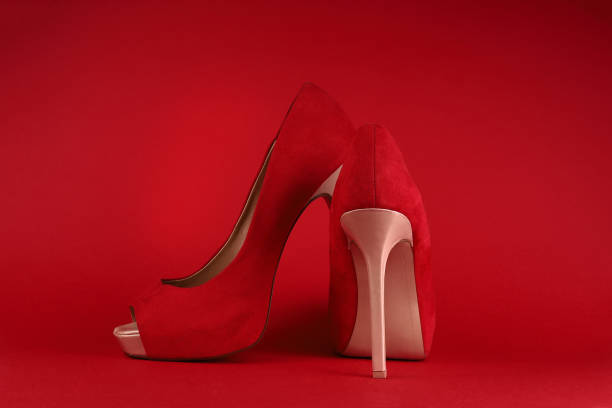 istock womens red shoes on beige heels on a red background 1312931219