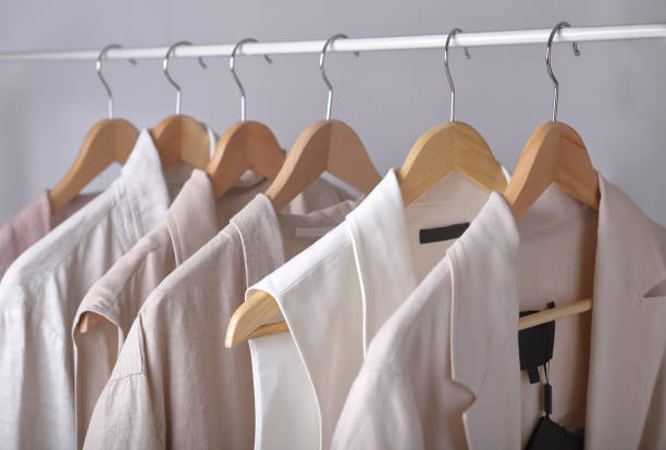 istock clothes in light pastel colors hanging on a rack. 1312931268