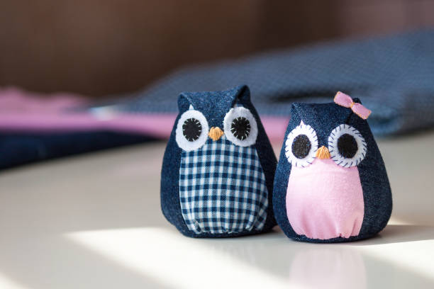 istock Hand made owls. Craft tools and materials on the table. 1312934324
