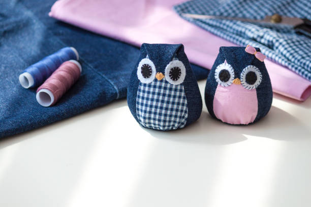 istock Hand made owls. Craft tools and materials on the table. 1312934381