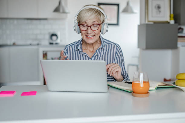 istock Senior woman is working from home 1312937696