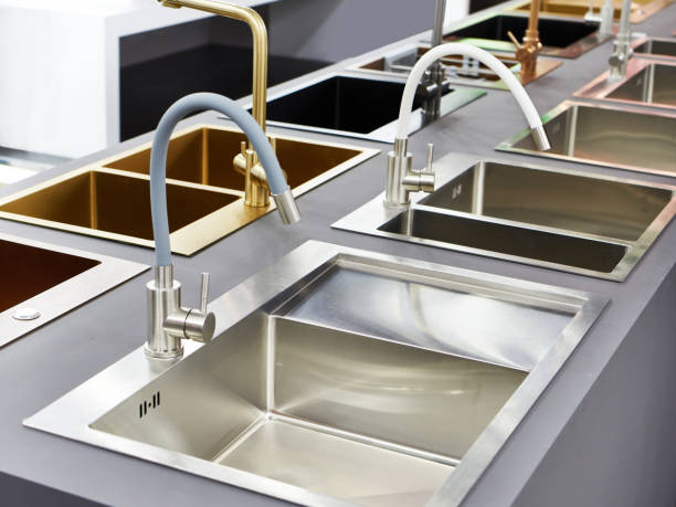istock Modern kitchen water faucets and kitchen sinks in store 1312937831