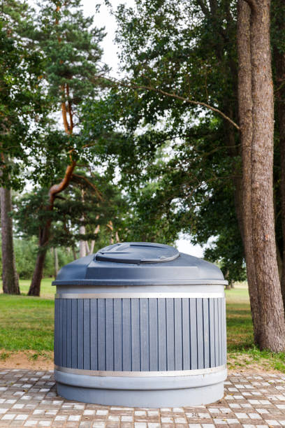 istock Modern trash can round container in park for separate collection of garbage 1312937921