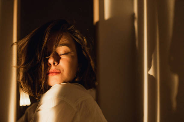 A young beautiful woman feels the pleasure of the lonely evening at home