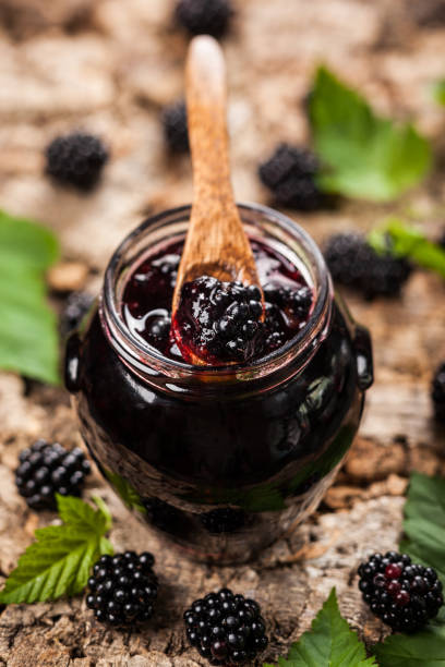 Blackberry jam Blackberry jam in a jar brambleberry stock pictures, royalty-free photos & images