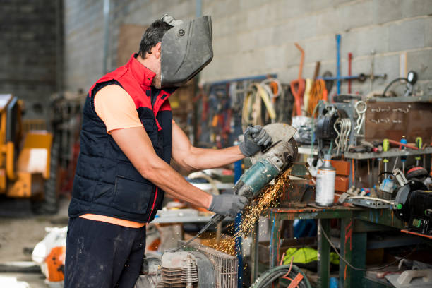 A man working with a large radial saw. Jaen, Spain