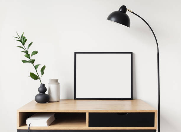 istock Blank picture frame mockup on a wall. Artwork showcase in a living room 1312943316
