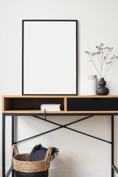 istock Blank picture frame mockup on a white wall. Artwork showcase in a living room 1312943322