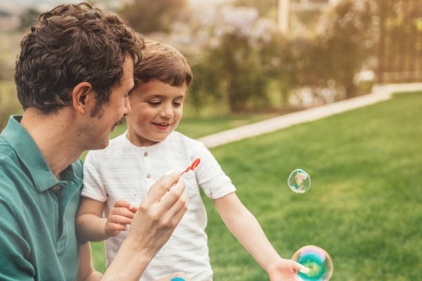 istock Family making bubbles at the garden 1312943797