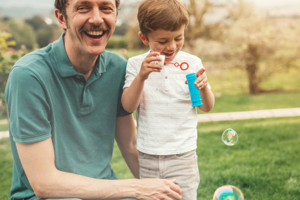 istock Family making bubbles at the garden 1312943804