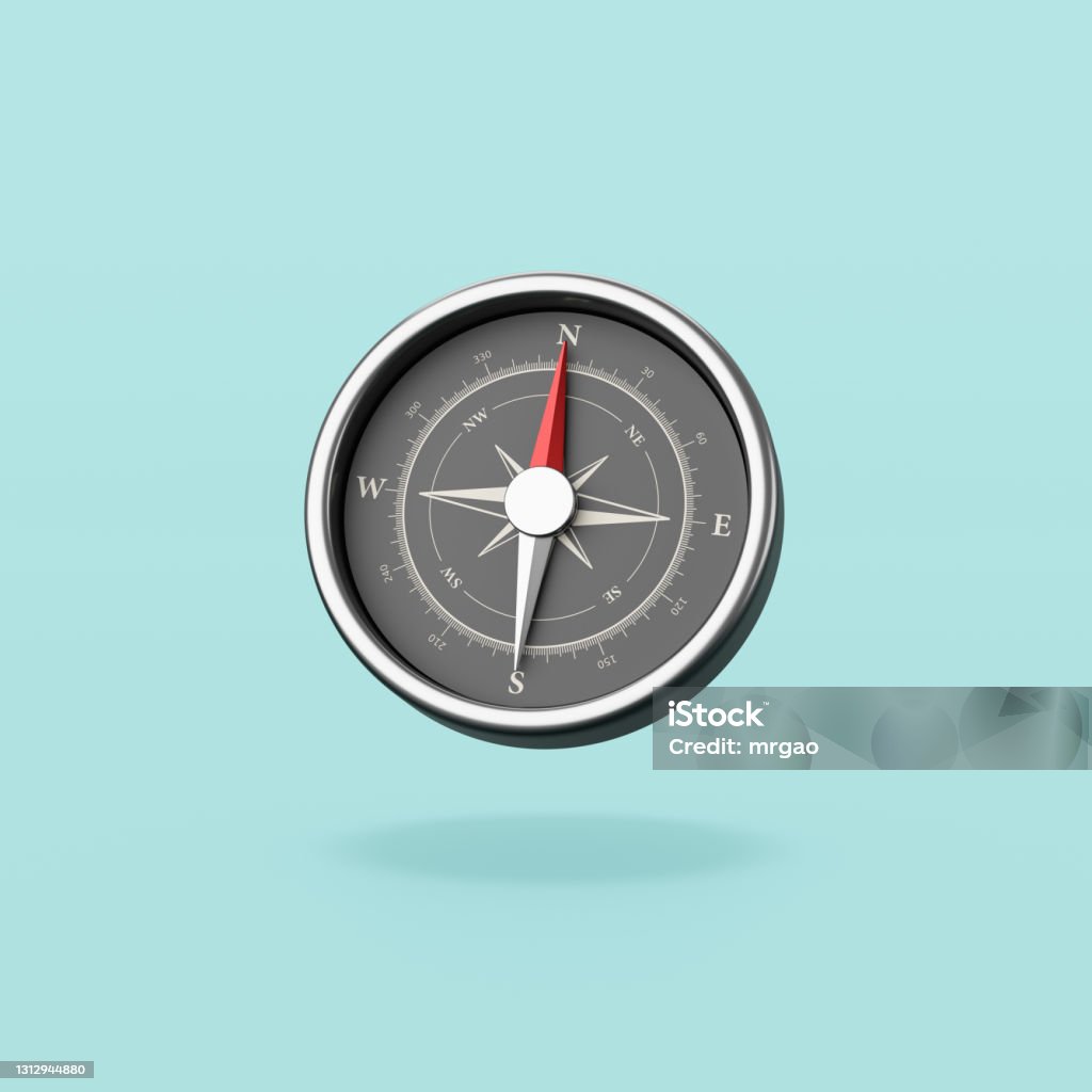 Metallic Compass on Blue Background Metallic Compass with Red Magnetic Needle Pointing Toward the North Isolated on Flat Blue Background with Shadow 3D Illustration Navigational Compass Stock Photo