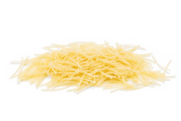 istock pasta vermicelli pile isolated on white background. dry vermicelli cut out 1312945653