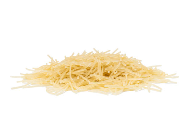 istock pasta vermicelli pile isolated on white background. dry vermicelli cut out 1312945687