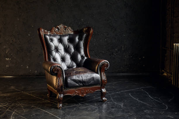 istock Black genuine leather classical style sofa in black room. Modern interior. Loft 1312947590