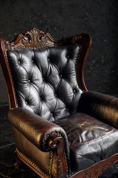 istock Black genuine leather classical style sofa in black room. Modern interior. Loft 1312947680