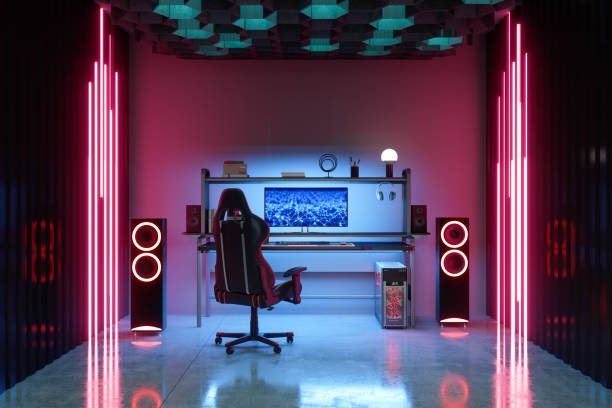 Gaming Room At Night With Neon Light. Gaming Chair And Speakers In The Room. Gaming Room At Night With Neon Light. Gaming Chair And Speakers In The Room. gaming chair photos stock pictures, royalty-free photos & images