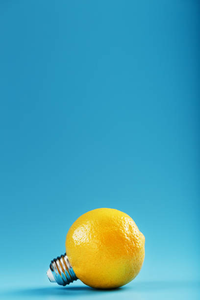 istock The light bulb is like a lemon on a blue background. 1312950099