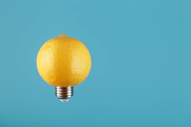 istock Light bulb lemon in flight on a blue background. The conceptual idea. 1312951212