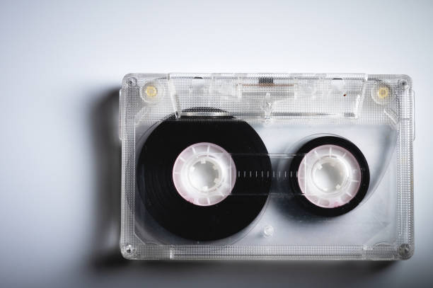 istock Audio cassettes on gray background retro background. Old sound recorders 1312951372