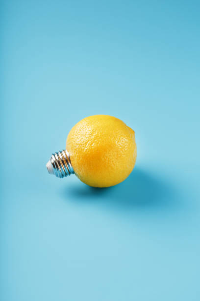istock The light bulb is like a lemon on a blue background. 1312951390