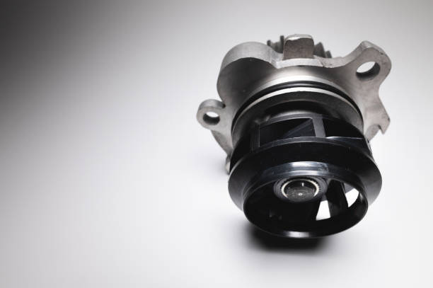 istock Water pump of the internal combustion engine cooling system. Contrasting on a gray gradient 1312952254
