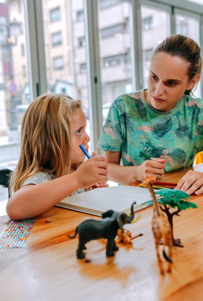 istock Mother explaining homework to her daughter 1312953531