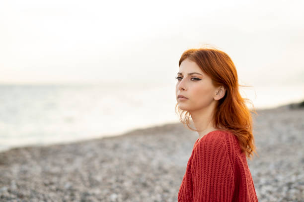 istock Relaxed confident young redhead woman 1312954293