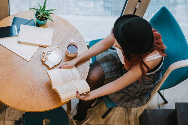 istock Top view of a young woman reading 1312955899