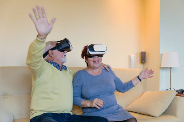 istock Cheerful Senior Couple is Having Fun with VR Glasses. The Future has Arrived. 1312956580