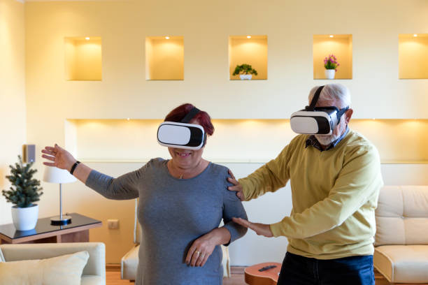 istock A Couple of Retirees is Gesturing and Smiling While Playing a Games on VR System. 1312956965