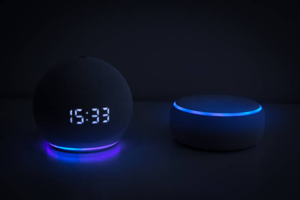 istock Voice controlled speaker with activated voice recognition, on black background. 1312959168