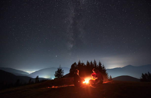 istock Romantic evening outdoors under starry sky in the mountains. 1312962940