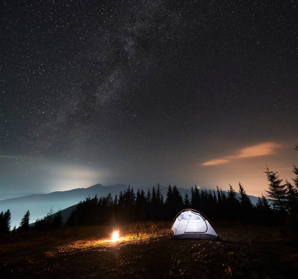 istock Camping at summer starry night in the mountains. 1312962995
