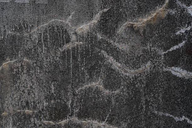 istock Gray wall with white stains as an abstract background 1312964374