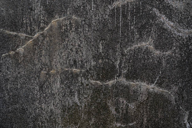 istock Gray wall with white stains as an abstract background 1312964380