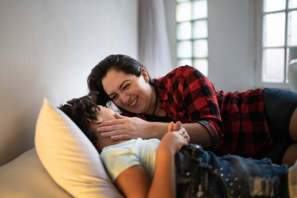 istock Mother and daughter together in bed 1312969174